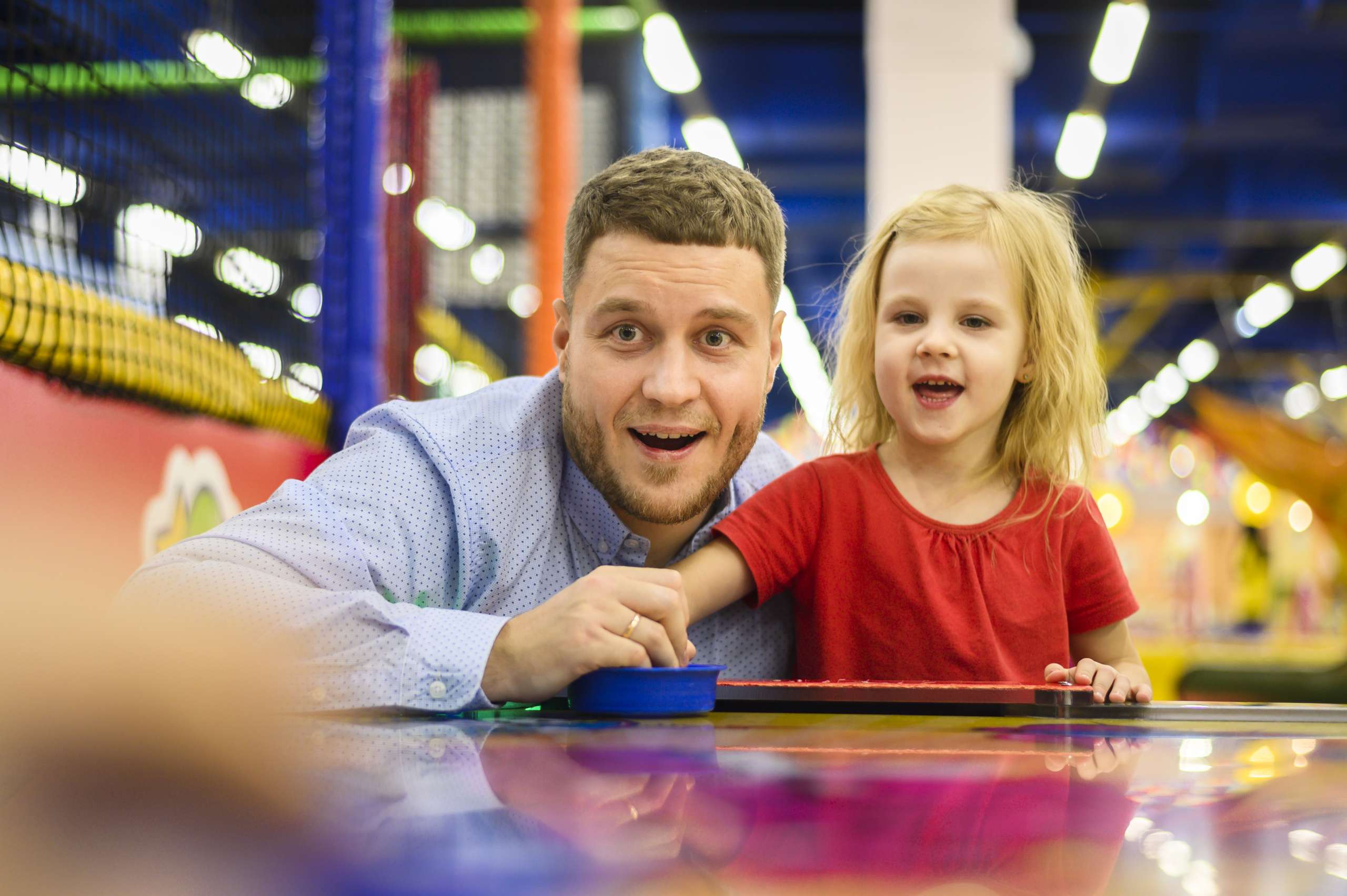 Benefits of Spending Time with Family - Dad having fun with daughter at an arcade place
